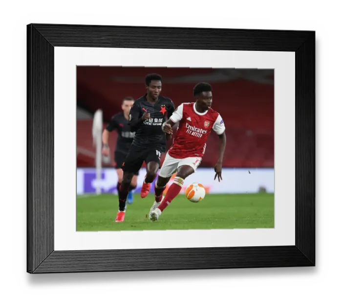 Framed Print : Bukayo Saka vs. Oscar Dorley: A Europa League Showdown in Empty Emirates Stadium Framed Print : Bukayo Saka vs. Oscar Dorley: A Europa League Showdown in Empty Emirates Stadium