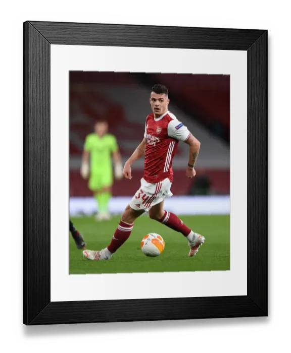 Framed Print : Arsenal's Granit Xhaka in UEFA Europa League Quarterfinal vs Slavia Praha at Empty Emirates Stadium