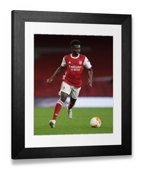 Framed Print : Arsenal's Bukayo Saka Shines in Empty Emirates: Arsenal FC vs Slavia Praha, UEFA Europa League Quarterfinals Framed Print : Arsenal's Bukayo Saka Shines in Empty Emirates: Arsenal FC vs Slavia Praha, UEFA Europa League Quarterfinals