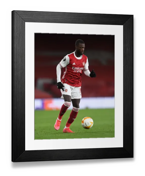 Framed Print : Arsenal's Nicolas Pepe in UEFA Europa League Quarterfinal: Arsenal FC vs Slavia Praha (Behind Closed Doors)