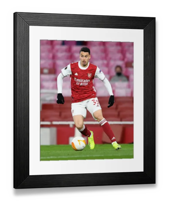 Framed Print : Lone Warrior: Gabriel Martinelli's Europa League Battle at Empty Emirates Stadium