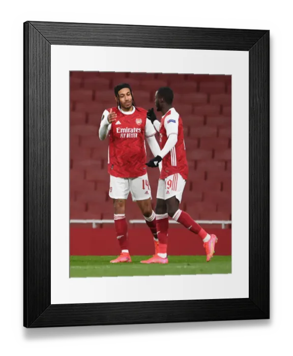 Framed Print : Arsenal's Nicolas Pepe and Pierre-Emerick Aubameyang Celebrate Goal in Empty Emirates Stadium during Arsenal v Slavia Prague UEFA Europa League Quarterfinal Framed Print : Arsenal's Nicolas Pepe and Pierre-Emerick Aubameyang Celebrate Goal in Empty Emirates Stadium during Arsenal v Slavia Prague UEFA Europa League Quarterfinal
