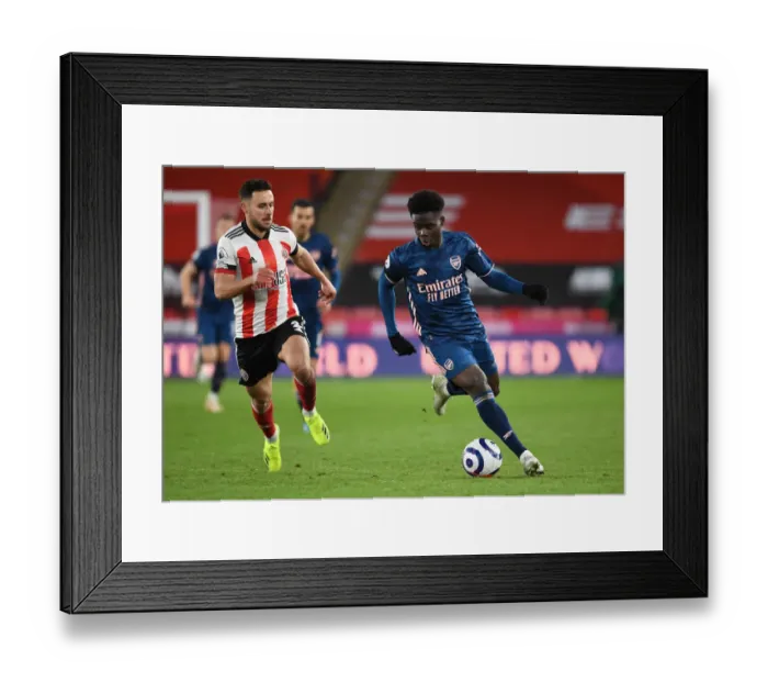 Framed Print : Bukayo Saka Breaks Past Sheffield United's George Baldock: Arsenal vs Sheffield United, Premier League 2021