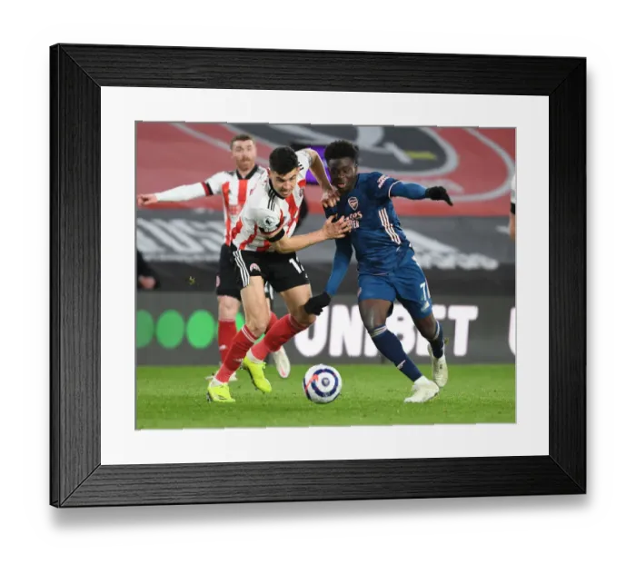 Framed Print : Bukayo Saka Breaks Past Sheffield United's John Egan in Empty Bramall Lane - Arsenal vs Sheffield United, Premier League 2020-21