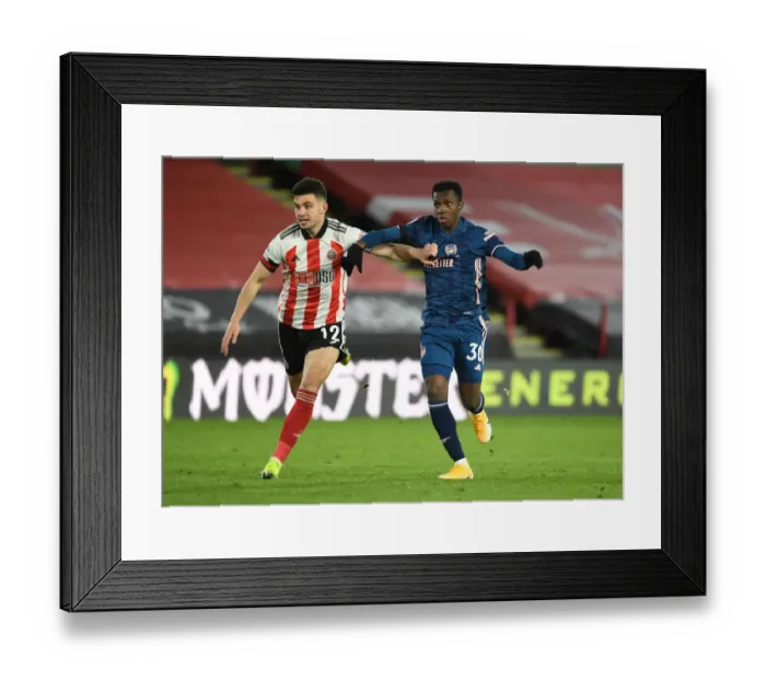 Framed Print : Nketiah vs. Egan: A Battle in Empty Bramall Lane - Arsenal vs. Sheffield United, Premier League 2020-21