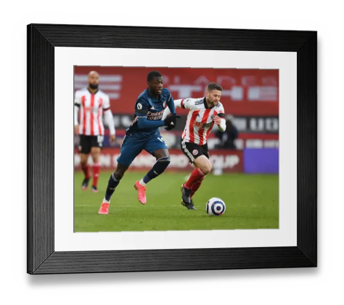 Framed Print : Arsenal's Nicolas Pepe in Action at Empty Bramall Lane: Sheffield United vs Arsenal, Premier League 2021