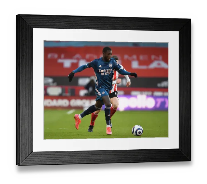 Framed Print : Empty Bramall Lane: Pepe Plays Out Silent Battle at Sheffield United vs Arsenal, 2021 Premier League