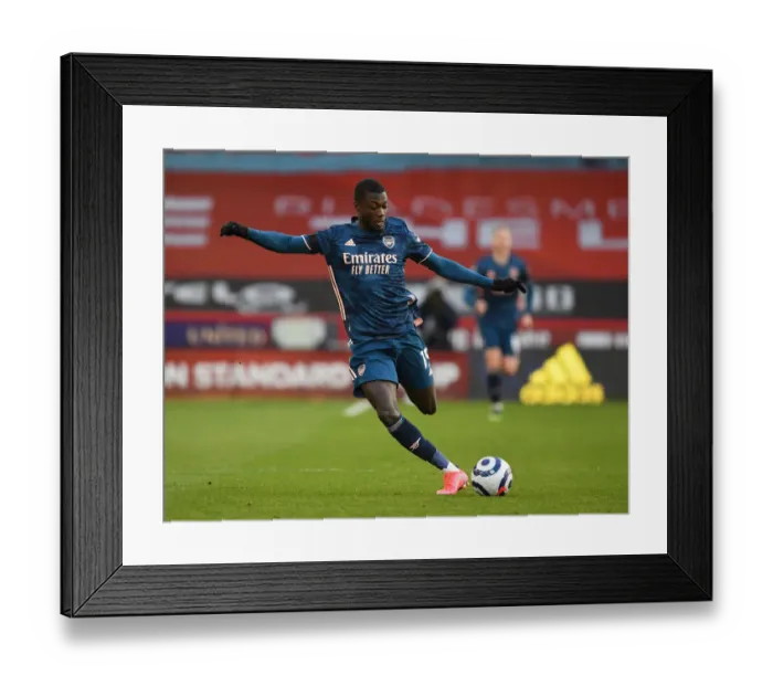 Framed Print : Empty Bramall Lane: Nicolas Pepe Plays Out COVID-19 Restricted Arsenal-Sheffield United Match Framed Print : Empty Bramall Lane: Nicolas Pepe Plays Out COVID-19 Restricted Arsenal-Sheffield United Match