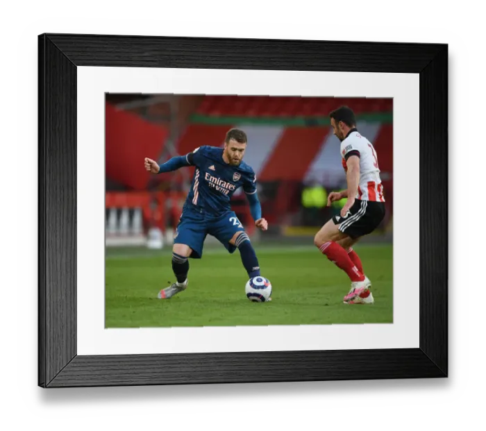 Framed Print : Arsenal's Calum Chambers Faces Off Against Sheffield United's Enda Stevens in Empty Bramall Lane - Premier League Clash 2021 Framed Print : Arsenal's Calum Chambers Faces Off Against Sheffield United's Enda Stevens in Empty Bramall Lane - Premier League Clash 2021
