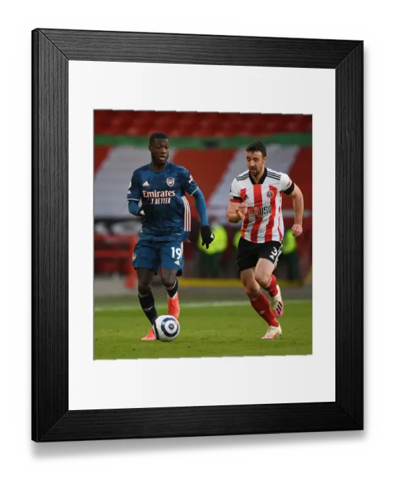 Framed Print : Pepe's Powerful Run: Arsenal's Thrilling Victory at Empty Bramall Lane vs. Sheffield United, Premier League 2020-21 Framed Print : Pepe's Powerful Run: Arsenal's Thrilling Victory at Empty Bramall Lane vs. Sheffield United, Premier League 2020-21