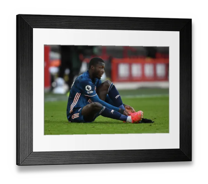 Framed Print : Empty Bramall Lane: Nicolas Pepe Plays Out Premier League Match Against Sheffield United Amidst COVID-19 Restrictions