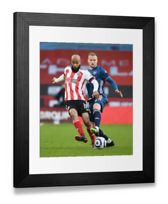 Framed Print : Holding Down Sheffield United: Arsenal's Rob Holding in Action Against David McGoldrick (April 2021) Framed Print : Holding Down Sheffield United: Arsenal's Rob Holding in Action Against David McGoldrick (April 2021)