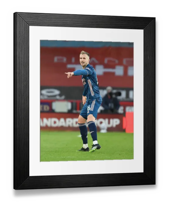 Framed Print : Arsenal's Rob Holding at Empty Bramall Lane: Premier League 2021 - Sheffield United vs Arsenal
