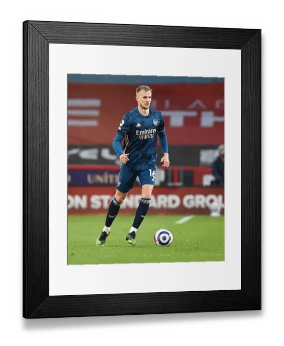 Framed Print : Arsenal's Rob Holding at Empty Bramall Lane: Premier League 2021 - Sheffield United vs Arsenal