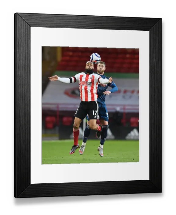 Framed Print : Chambers vs McGoldrick: A Battle at Empty Bramall Lane - Sheffield United vs Arsenal, Premier League 2021 Framed Print : Chambers vs McGoldrick: A Battle at Empty Bramall Lane - Sheffield United vs Arsenal, Premier League 2021