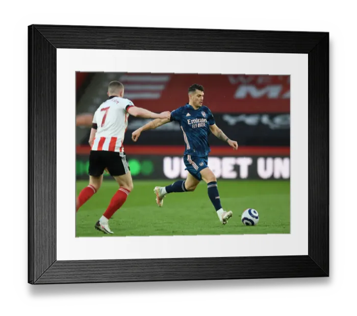 Framed Print : Granit Xhaka's Brilliant Midfield Performance: Arsenal's Victory Over Sheffield United, Premier League 2020-21