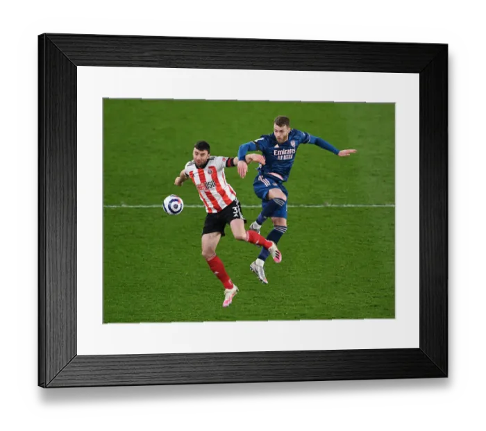 Framed Print : Arsenal's Calum Chambers Fights for Control Against Sheffield United in Premier League Clash