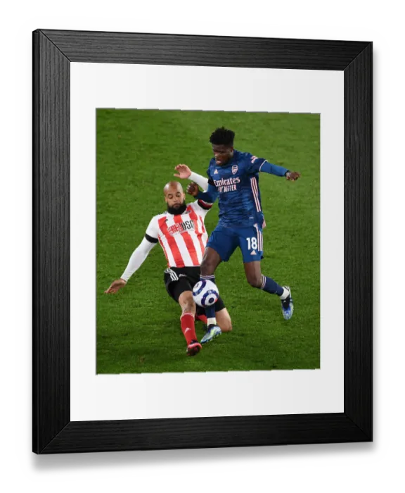 Framed Print : Thomas Partey vs. David McGoldrick: A Battle in the Premier League - Sheffield United vs. Arsenal (April 2021)
