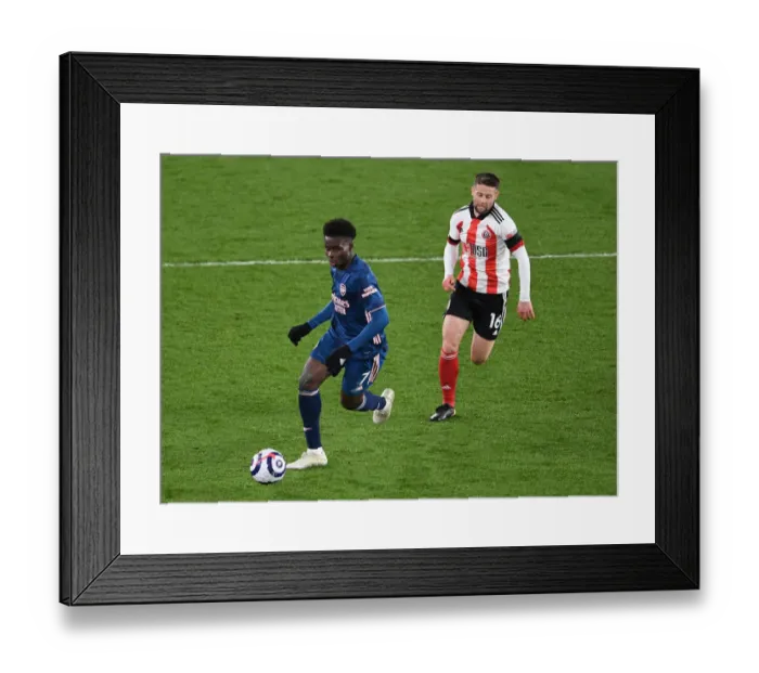 Framed Print : Bukayo Saka vs. Oliver Norwood: Battle at Bramall Lane - Sheffield United vs. Arsenal, Premier League 2020-21