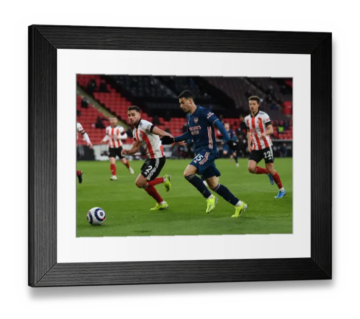 Framed Print : Martinelli vs Baldock: A Premier League Battle - Sheffield United vs Arsenal (April 2021)