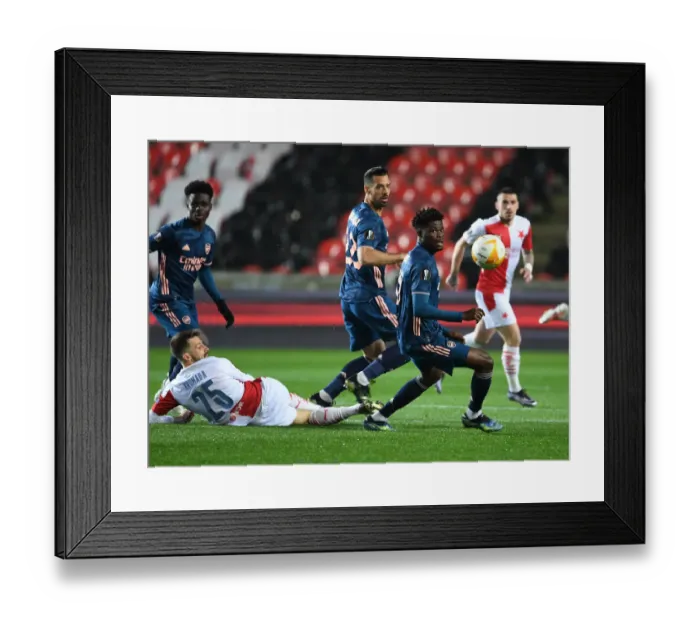Framed Print : Thomas Partey vs Jakub Hromada: Arsenal's Europa League Battle at Empty Eden Arena Against Slavia Praha