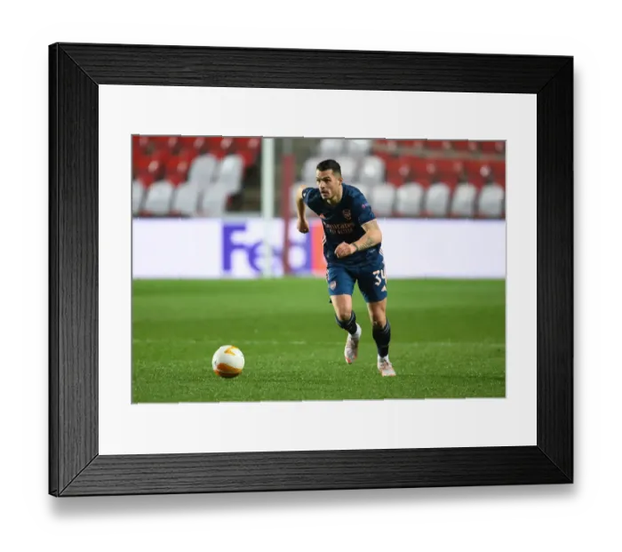 Framed Print : Lone Warrior Xhaka: Arsenal's Battle in Empty Eden Arena, UEFA Europa League Quarterfinal