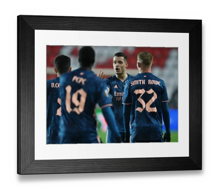 Framed Print : Lone Warrior Xhaka: Arsenal's UEFA Europa League Battle in Empty Eden Arena