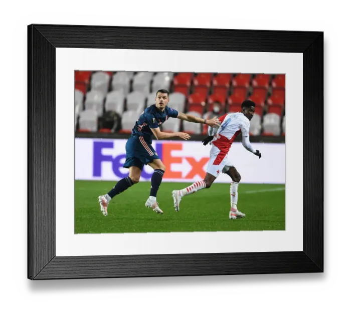 Framed Print : Arsenal's Granit Xhaka Clashes with Slavia Praha's Peter Olayinka in UEFA Europa League Quarterfinal: Prague Showdown Framed Print : Arsenal's Granit Xhaka Clashes with Slavia Praha's Peter Olayinka in UEFA Europa League Quarterfinal: Prague Showdown