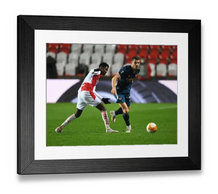 Framed Print : Xhaka vs. Olayinka Showdown: Empty Battlefield - Arsenal's Europa League Clash with Slavia Prague, Czech Republic Framed Print : Xhaka vs. Olayinka Showdown: Empty Battlefield - Arsenal's Europa League Clash with Slavia Prague, Czech Republic