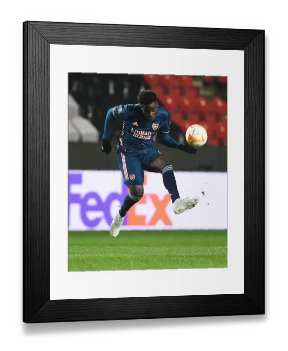 Framed Print : Arsenal's Bukayo Saka in UEFA Europa League Quarterfinal Match against Slavia Praha in Prague (Behind Closed Doors) Framed Print : Arsenal's Bukayo Saka in UEFA Europa League Quarterfinal Match against Slavia Praha in Prague (Behind Closed Doors)