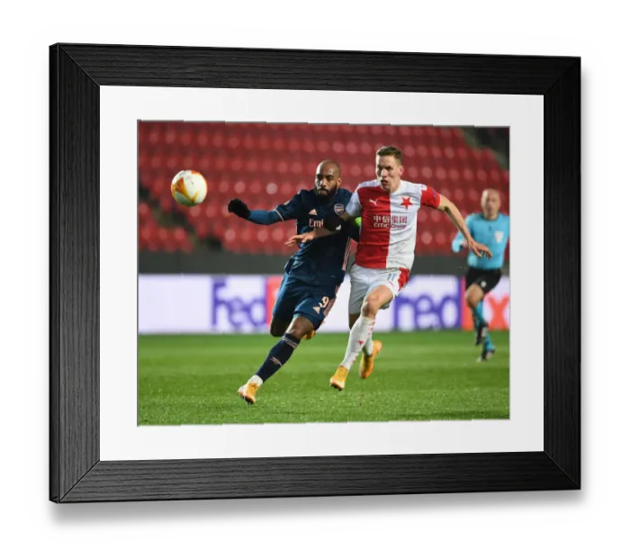 Framed Print : Arsenal's Alex Lacazette Breaks Past Slavia Praha's Lukas Provod in UEFA Europa League Quarterfinal Match in Prague