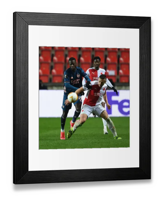 Framed Print : Arsenal's Nicolas Pepe Faces Off Against Slavia Praha's Tomas Holes in Europa League Quarterfinal: Prague Showdown Framed Print : Arsenal's Nicolas Pepe Faces Off Against Slavia Praha's Tomas Holes in Europa League Quarterfinal: Prague Showdown
