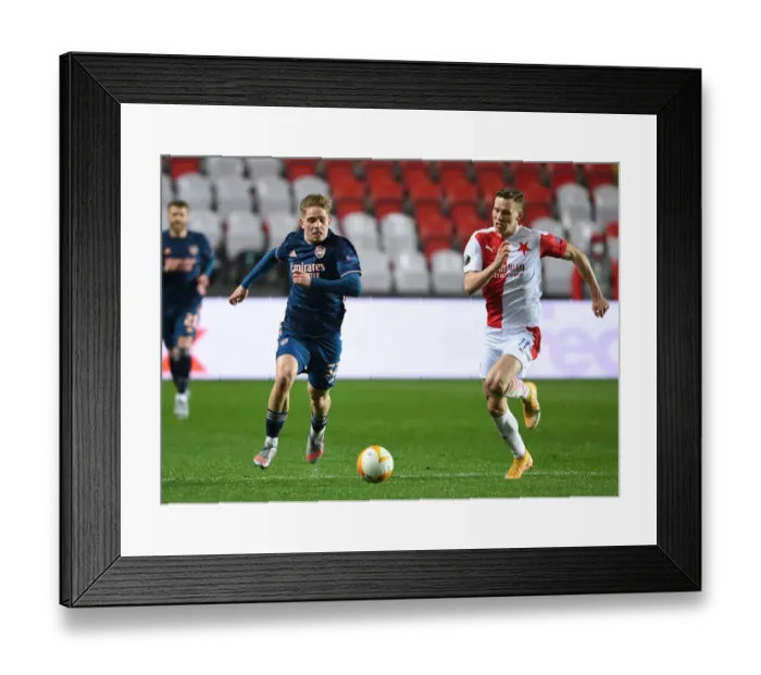 Framed Print : Arsenal's Emile Smith Rowe Clashes with Slavia Praha's Lukas Provod in UEFA Europa League Quarterfinal: Prague Showdown Amidst Empty Stands Framed Print : Arsenal's Emile Smith Rowe Clashes with Slavia Praha's Lukas Provod in UEFA Europa League Quarterfinal: Prague Showdown Amidst Empty Stands