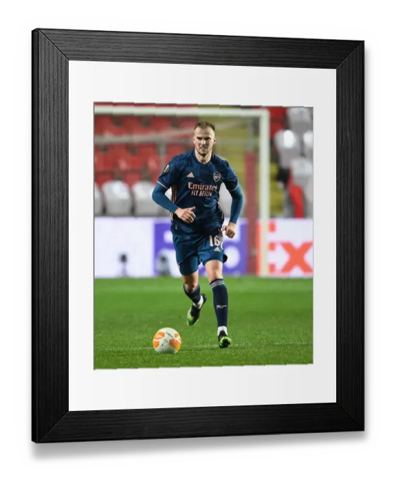 Framed Print : Arsenal's Rob Holding in UEFA Europa League Quarterfinal Match against Slavia Praha in Prague Amidst Empty Stands Framed Print : Arsenal's Rob Holding in UEFA Europa League Quarterfinal Match against Slavia Praha in Prague Amidst Empty Stands