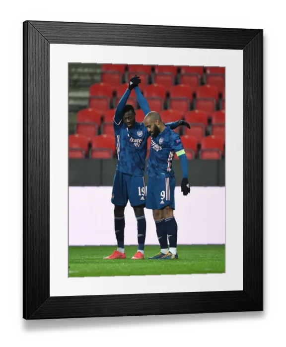 Framed Print : Arsenal's Lacazette and Pepe: Empty Eden Arena Celebrations - Arsenal's Europa League Victory over Slavia Prague Framed Print : Arsenal's Lacazette and Pepe: Empty Eden Arena Celebrations - Arsenal's Europa League Victory over Slavia Prague
