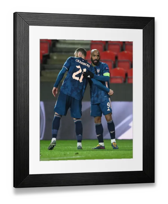 Framed Print : Alexis Lacazette and Calum Chambers: Celebrating Arsenal's Europa League Victory over Slavia Prague in an Empty Eden Arena (April 2021)