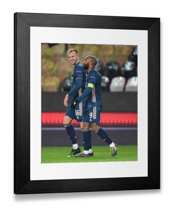Framed Print : Arsenal's Alex Lacazette and Rob Holding Celebrate Goals in Empty Eden Arena: Slavia Prague vs Arsenal, UEFA Europa League Quarterfinal