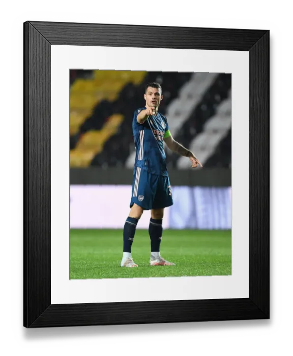 Framed Print : Arsenal's Granit Xhaka in UEFA Europa League Quarterfinal Match against Slavia Praha in Prague (Behind Closed Doors) Framed Print : Arsenal's Granit Xhaka in UEFA Europa League Quarterfinal Match against Slavia Praha in Prague (Behind Closed Doors)