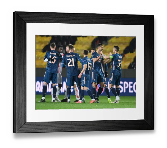 Framed Print : Arsenal Celebrates Empty Eden Arena Victory in Europa League Quarterfinals Against Slavia Praha