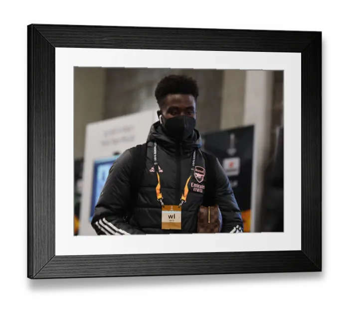 Framed Print : Arsenal's Bykayo Saka Arrives at Empty Eden Arena for Slavia Prague Showdown - UEFA Europa League Quarterfinals Framed Print : Arsenal's Bykayo Saka Arrives at Empty Eden Arena for Slavia Prague Showdown - UEFA Europa League Quarterfinals