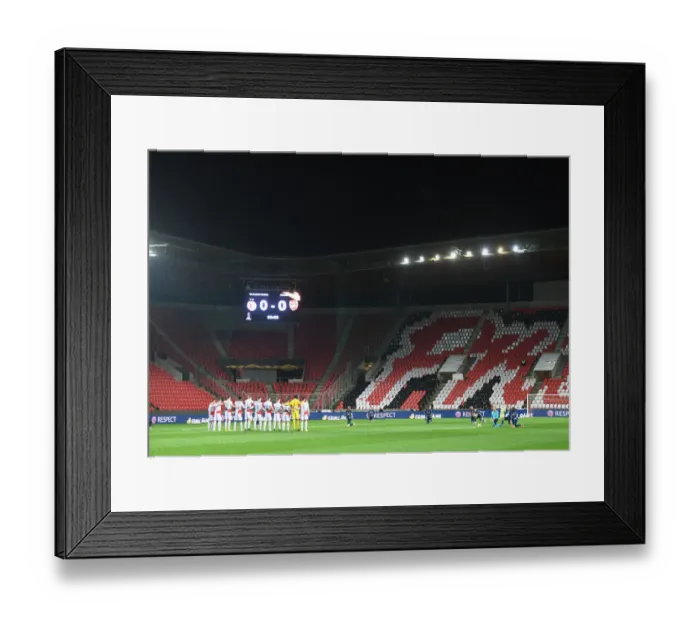 Framed Print : Arsenal and Slavia Prague Players Unite in Silence: Taking a Knee before Empty Stands in UEFA Europa League Quarterfinal, Prague, 2021