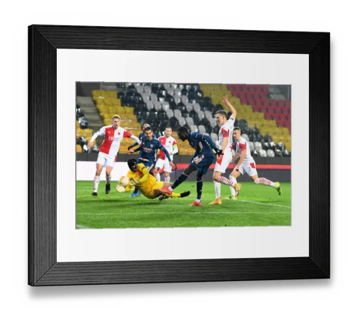 Framed Print : Arsenal's Nicolas Pepe Scores in Empty Eden Arena: Slavia Prague vs Arsenal, UEFA Europa League Quarterfinal Leg Two
