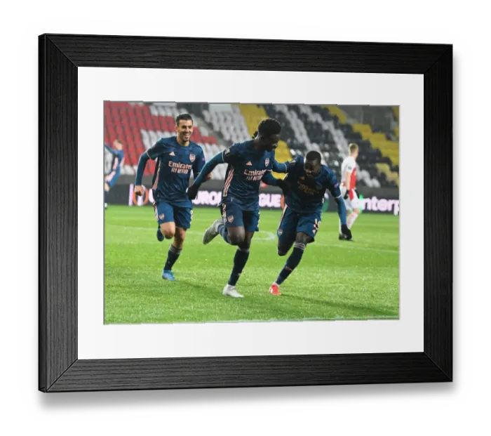 Framed Print : Arsenal's Bukayo Saka, Dani Ceballos, and Nicolas Pepe Celebrate Goals in Empty Eden Arena during Slavia Prague vs Arsenal UEFA Europa League Quarterfinal Framed Print : Arsenal's Bukayo Saka, Dani Ceballos, and Nicolas Pepe Celebrate Goals in Empty Eden Arena during Slavia Prague vs Arsenal UEFA Europa League Quarterfinal