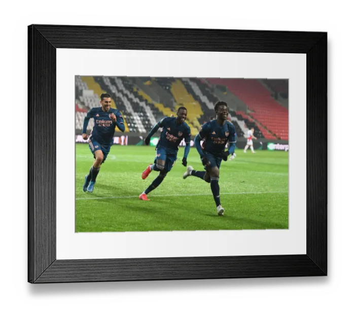Framed Print : Arsenal's Saka, Ceballos, and Pepe: Empty Eden Arena Goal Celebrations during UEFA Europa League Quarterfinals