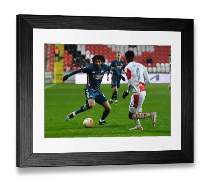 Framed Print : Arsenal's Elneny Clashes with Slavia Praha's Olayinka in UEFA Europa League Quarterfinal: Prague Showdown Amidst Empty Stands