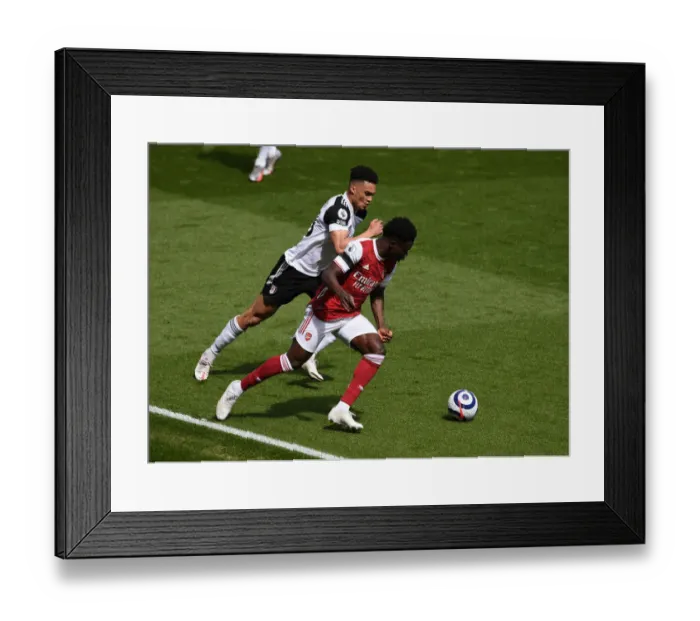 Framed Print : Battling Wings: Saka vs. Robinson in an Empty Emirates Showdown - Arsenal vs. Fulham, 2021