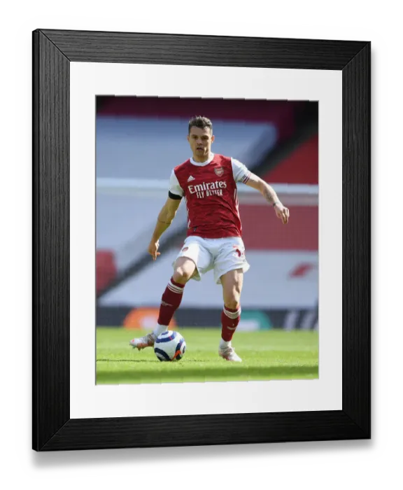 Framed Print : Granit Xhaka: Arsenal's Midfield Mastermind Shines in Empty Emirates Stadium Framed Print : Granit Xhaka: Arsenal's Midfield Mastermind Shines in Empty Emirates Stadium