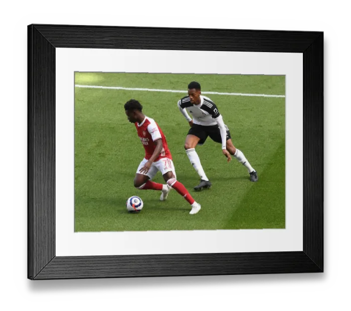 Framed Print : Arsenal's Bukayo Saka Faces Off Against Fulham's Tosin Adarabioyo in Empty Emirates Stadium, Premier League 2020-21