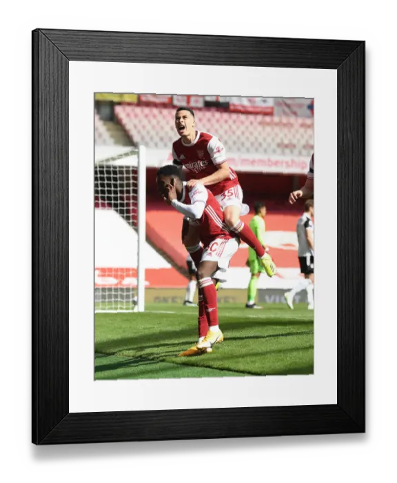 Framed Print : Arsenal's Nketiah and Martinelli Celebrate Goal Amid Empty Emirates Stadium Against Fulham, April 2021 Framed Print : Arsenal's Nketiah and Martinelli Celebrate Goal Amid Empty Emirates Stadium Against Fulham, April 2021