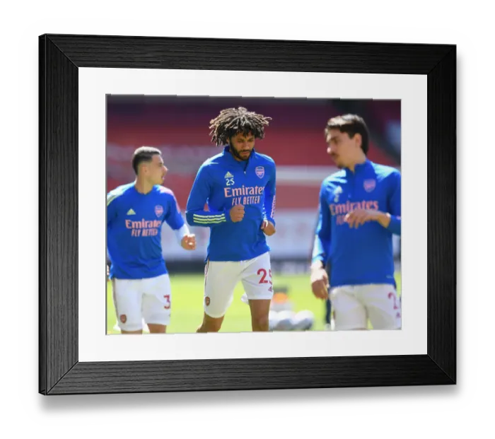 Framed Print : Arsenal's Mohamed Elneny Prepares for Fulham Clash at Empty Emirates Stadium (Arsenal v Fulham, 2021-22 Premier League)